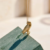 9ct Yellow Gold hand crafted African Fish Eagle necklace with detailed face and wing pattern.