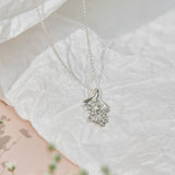 Forget-Me-Not flower inspired pendant with leaf detail, manufactured in sterling silver, and on a sterling silver rolo chain