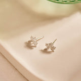 Forget-Me-Not Flower inspired studs with leaf details manufactured in sterling silver