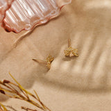 Forget-Me-Not Flower inspired studs with leaf details manufactured in 9ct yellow gold