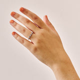 Luxury handmade platinum wedding ring featuring an intricate French pavé setting with baguette-cut natural diamonds and round light blue sapphires; a unique, high-end design perfect for weddings or milestone gifts.