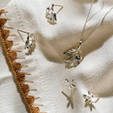 Botania's lemon blossom pendant and earrings in silver.