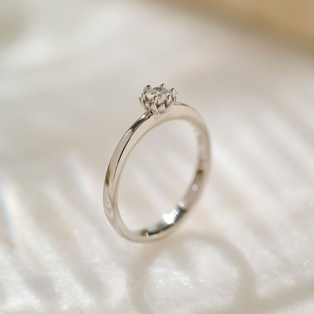 A side view of a solid platinum diamond Botanica Protea Ring showing the detailed solid petals crafted to look like a Protea's.