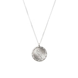 Sterling silver disc pendant with a hand engraved Confetti Bush wildflower illustration