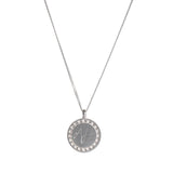 Sterling silver disc pendant with wreath border and engraved initials.