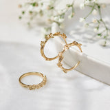 Forget-Me-Not Flower inspired ring with leaf details - manufactured in 9ct yellow gold. Photographed with the Forget-Me-Not Hoops in yellow gold.