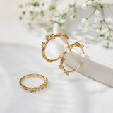 9ct yellow gold hoop earrings with Forget-Me-Not flower and leaf details photographed with the Forget-Me-Not ring