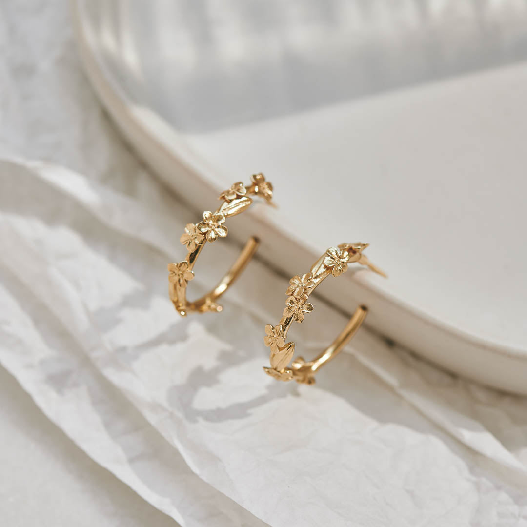 9ct yellow gold hoop earrings with Forget-Me-Not flower and leaf details