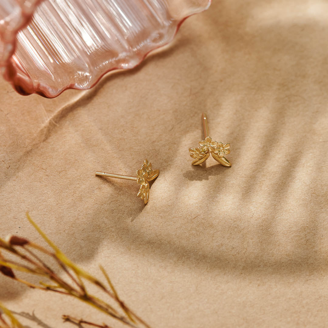 Forget-Me-Not Flower inspired studs with leaf details manufactured in 9ct yellow gold