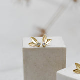 Yellow gold two leaf stud earrings set with diamonds