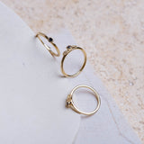 Three yellow gold stacking rings set with black diamonds