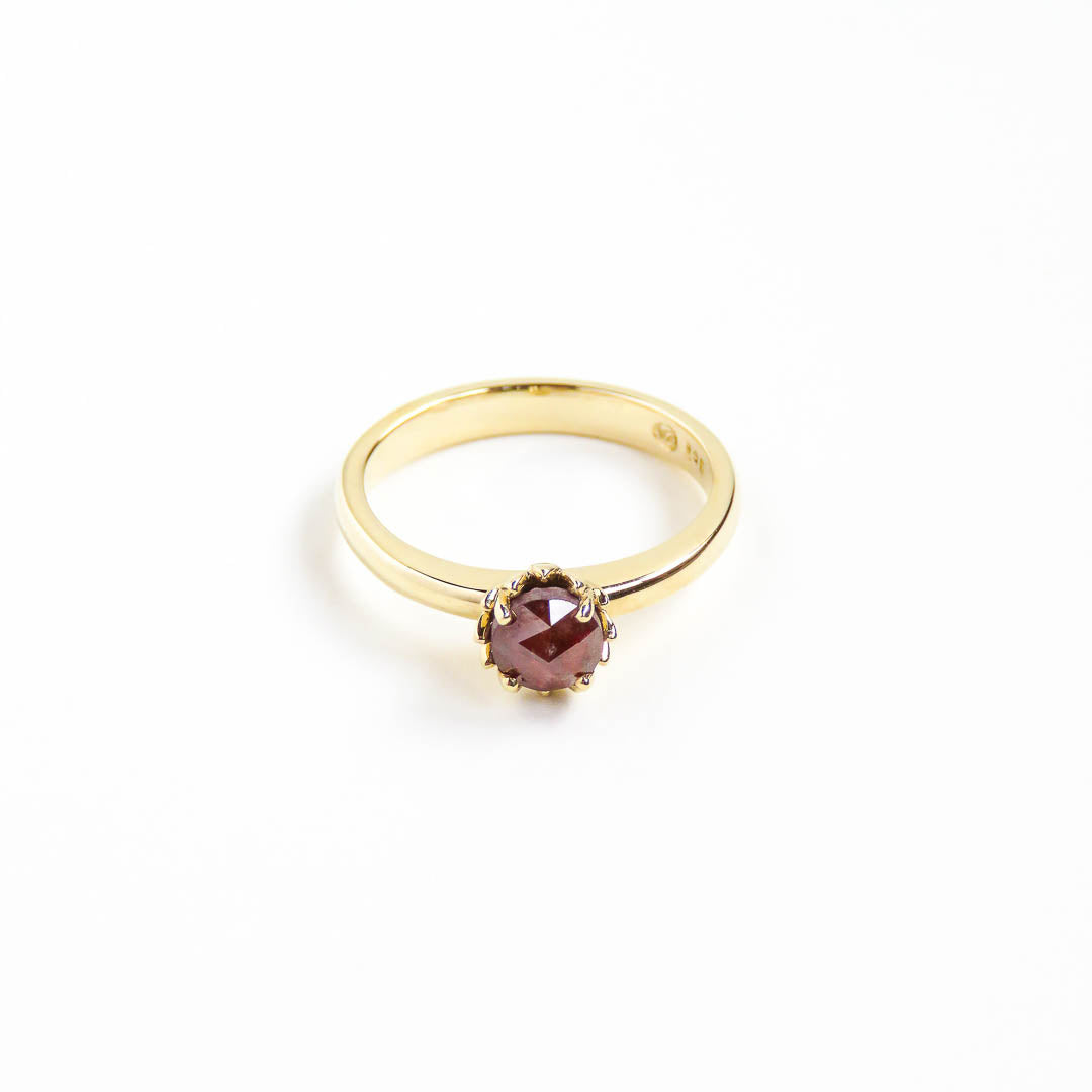 A unique red rose cut diamond set in Botanica's Protea ring manufactured in 9ct yellow gold