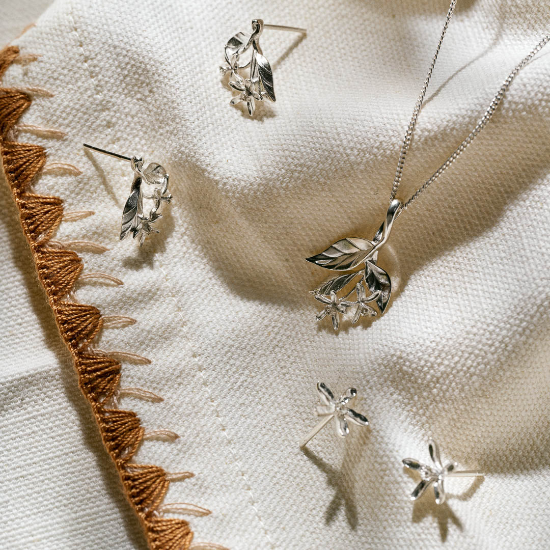 Botania's lemon blossom pendant and earrings in silver.