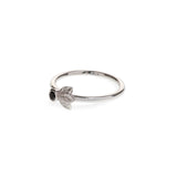 Black diamond in a classic tube setting on a sterling silver ring with three leaf details