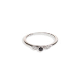 Black diamond in a classic tube setting on a sterling silver ring with two leaf details